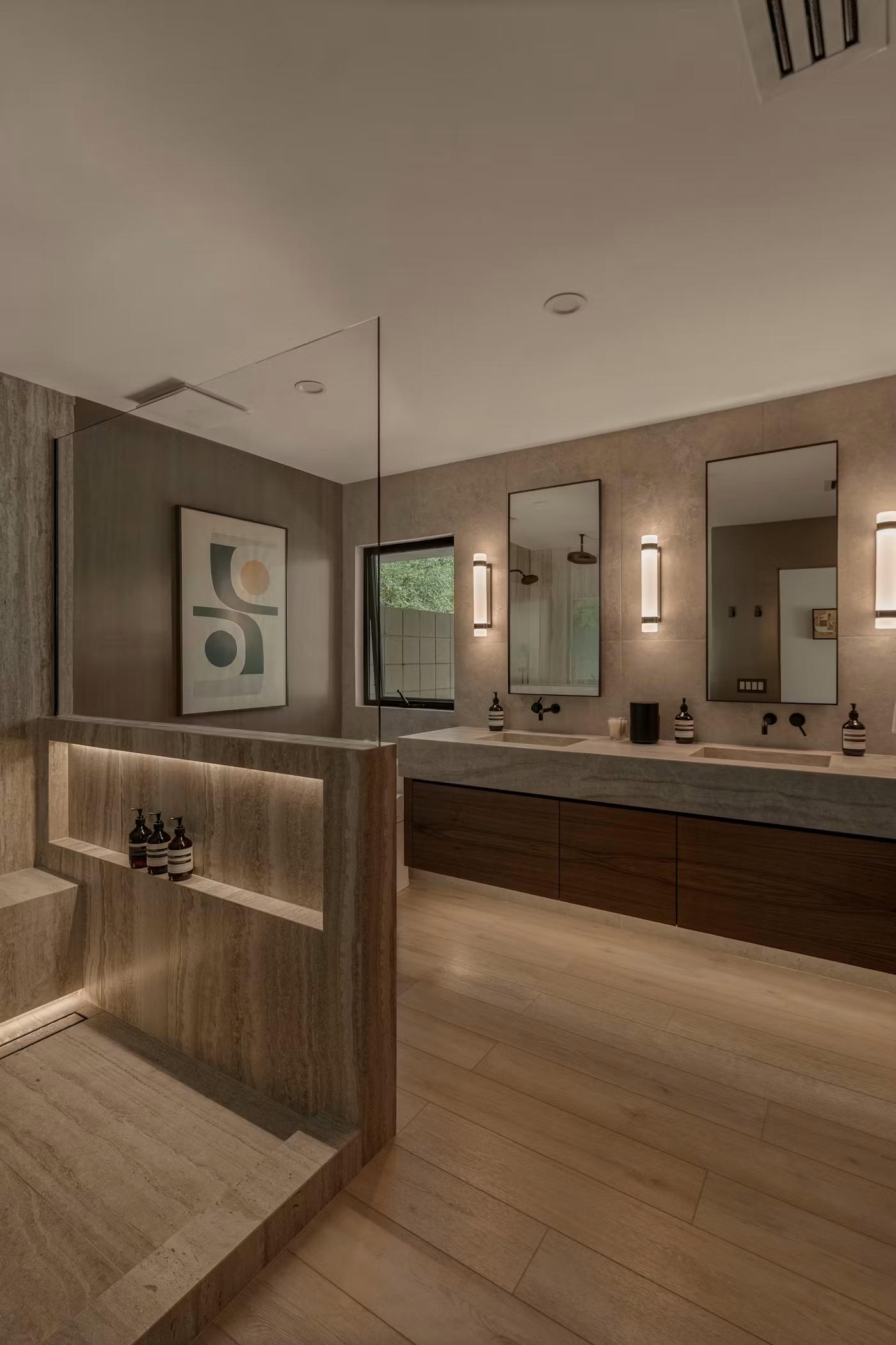 Primary bathroom with double vanity and freestanding partition wall