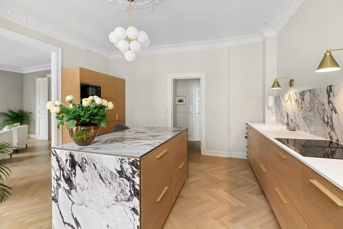 Kitchen island with marble waterfall countertop