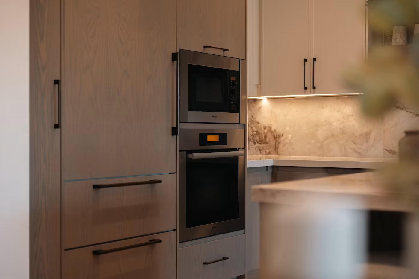 Built-in wall oven and microwave cabinetry detail